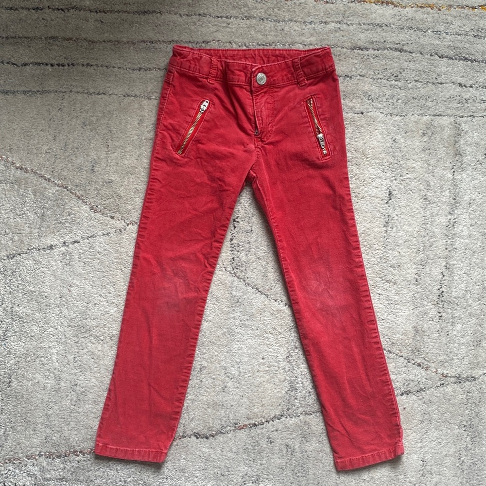 Red skinny corduroys with cool zippers